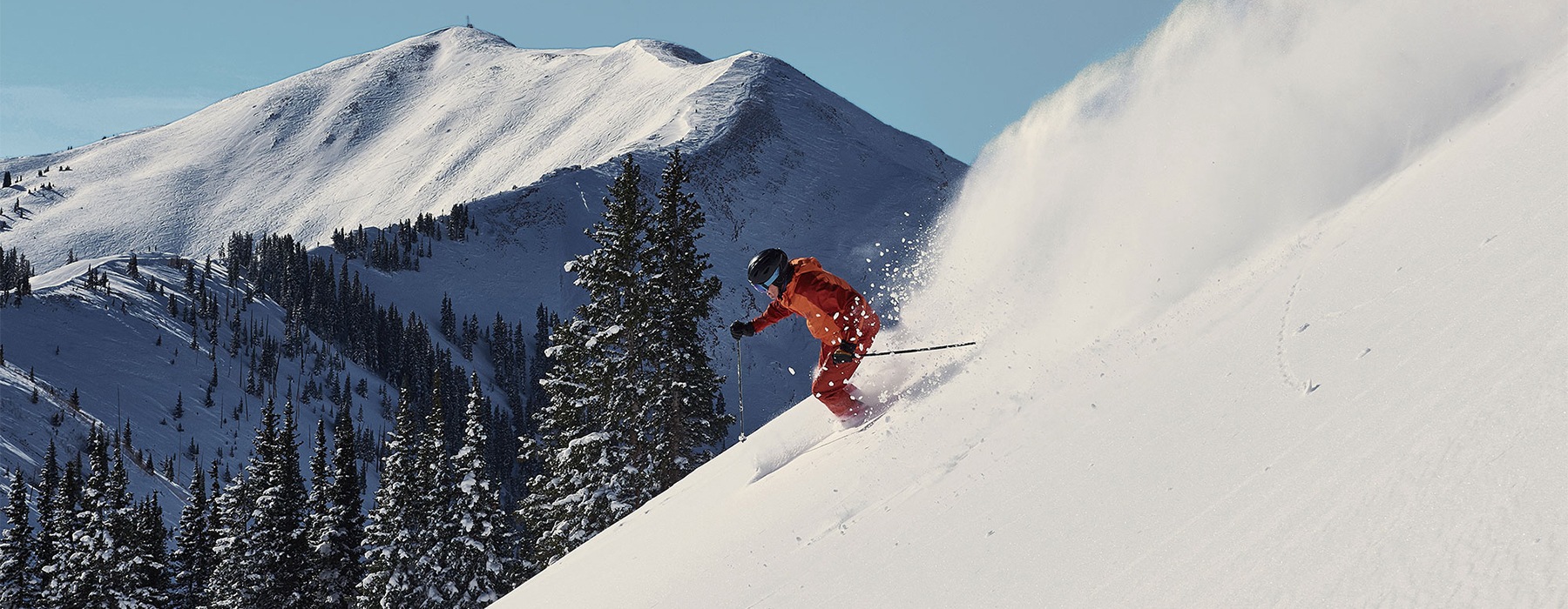 a person skiing down a snowy mountain