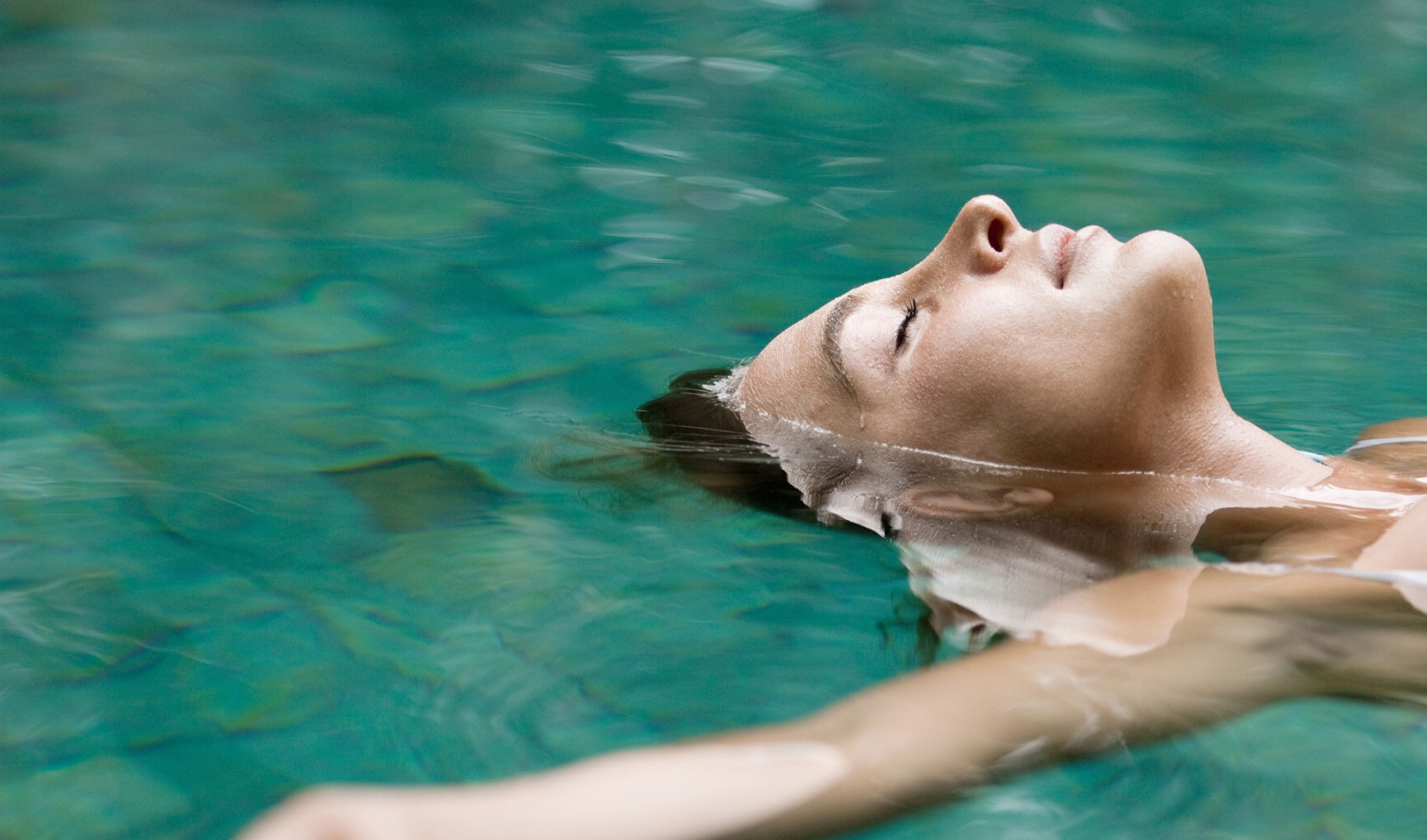 a woman laying in water